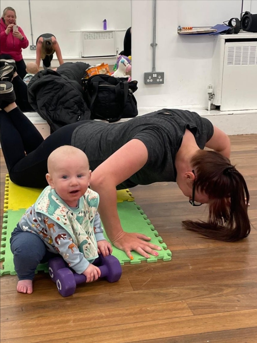 Mam enjoying a fitness class with her baby in South Tyneside